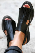 sandali neri slingback con cinturino e cut-out con rifiniture a frange.