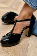 tacchi chunky neri con punta chiusa e cinturino a T con fibbia colorblock.