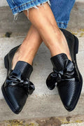 mocassini neri slip on punta affusolata fiocco stampa pitonata.